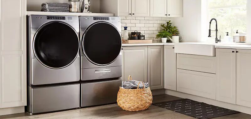 Whirlpool front-load washer and dryer set in a modern Greenville laundry room